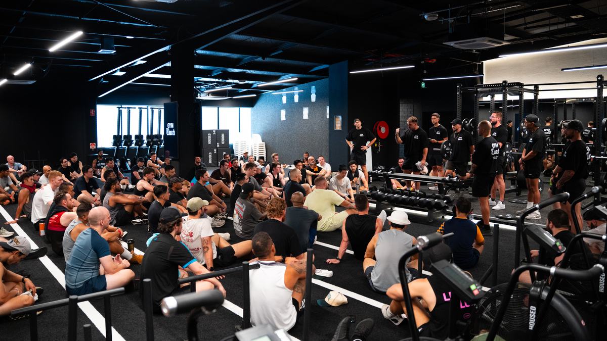 Men gathered at the Gym Church Sydney event at HOUSED gym